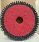A circular rotary brush attachment with a red center and dark gray bristles, shown against a light background.